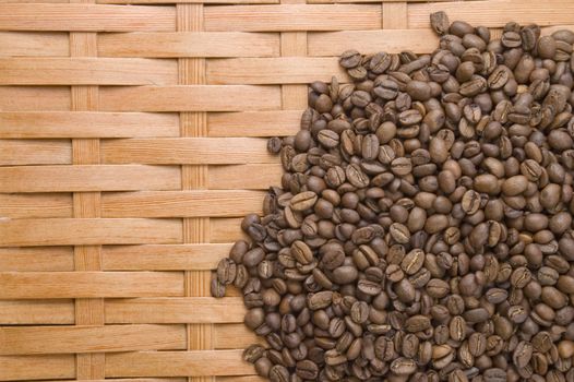Coffee in grains on a background of a tree.