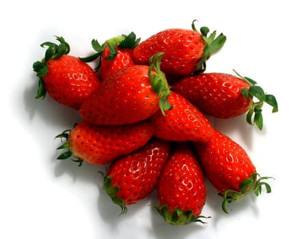 Close-up of brightly red strawberries on a white background.