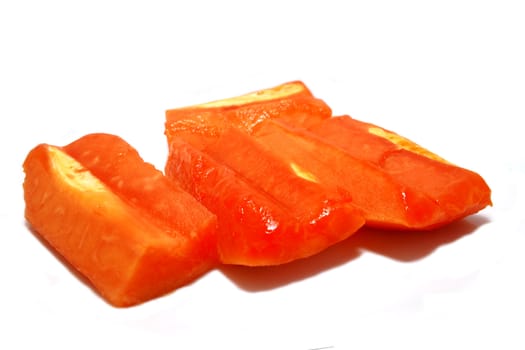 Cutted papaya fruits on white background with sharow.