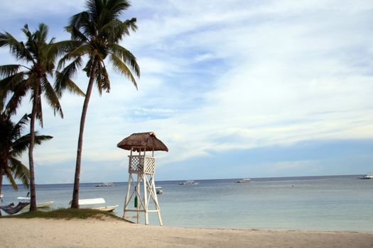 tall lifeguard watch tower at the beach
