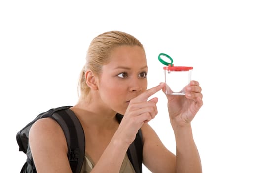 Pretty blond girl with a little examining box with a small spider 