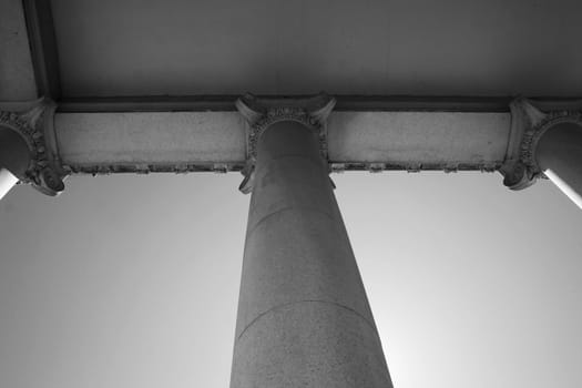 Tall columns over blue sky.