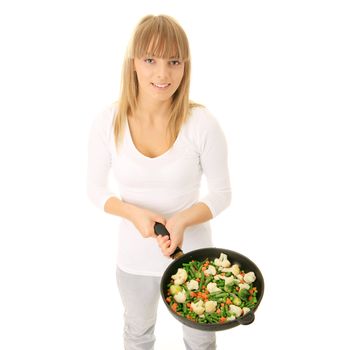 Image of a young woman cooking healthy food in the kitchen