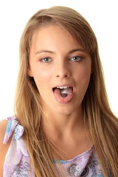 Young woman eating a pill isolated on white background
