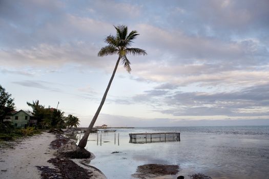 A small fishpen in the shallows close to a beautiful beach in the Gulf of Mexico at sunset.