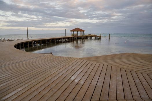 A new wooden pier and hut in the late evening light in the Gulf of Mexico.