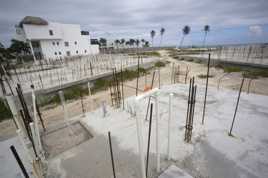 An empty construction site on the beach in the warm tropics of the Gulf of Mexico.