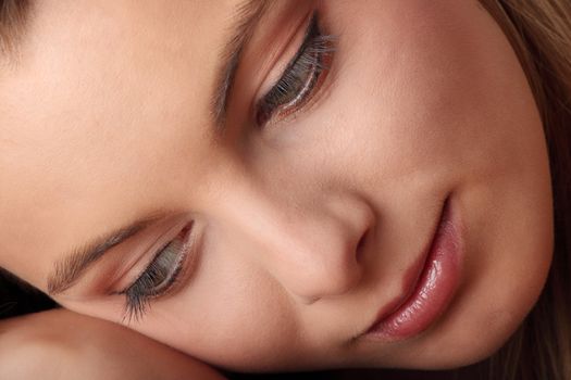 Young beautiful woman portrait isolated on black background