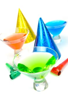 Cosmopolitan cocktails and party favours isolated against a white background