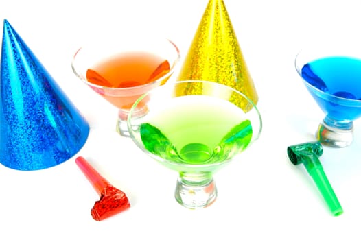 Cosmopolitan cocktails and party favours isolated against a white background