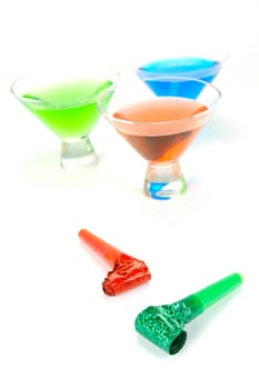Cosmopolitan cocktails and party favours isolated against a white background