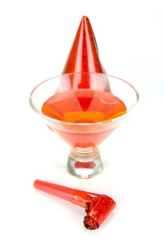 Cosmopolitan cocktails and party favours isolated against a white background