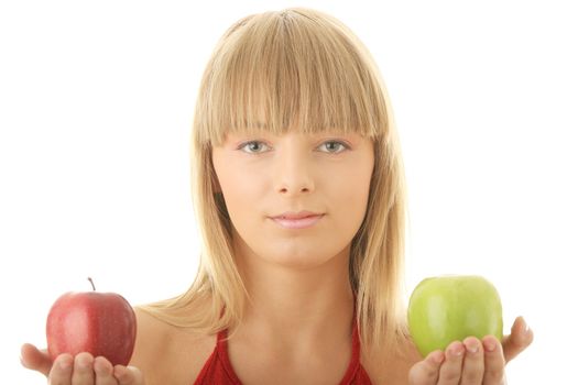 Young blond woman with red and green apples on her hand - making decision concept