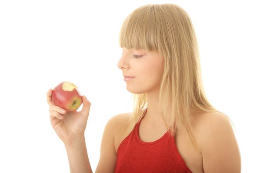 Young blond woman with red apple isolated on white background - healthy concept