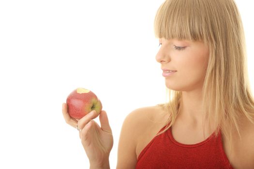 Young blond woman with red apple isolated on white background - healthy concept