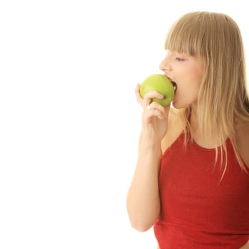 Young blond woman with green apple isolated on white background - healthy concept