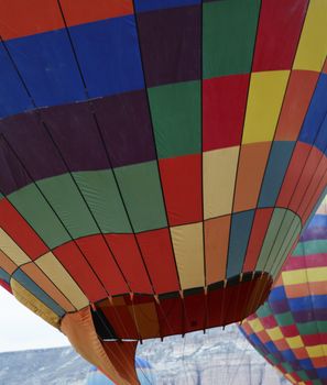 Two on the ground hot air balloons texture, vertical, multi colors and crop space