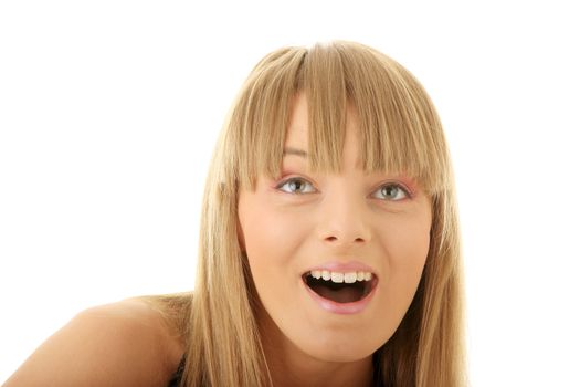 Face of a young shocked woman. Close up