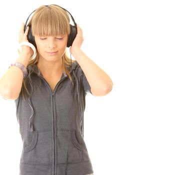 Young beautiful happy women listening music in headphones