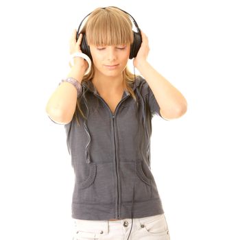 Young beautiful happy women listening music in headphones