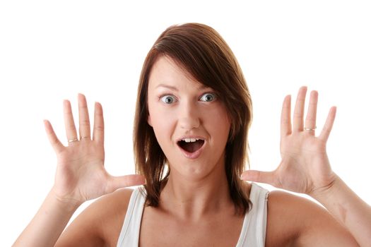 Casual caucasianbrunette woman suprised over white background