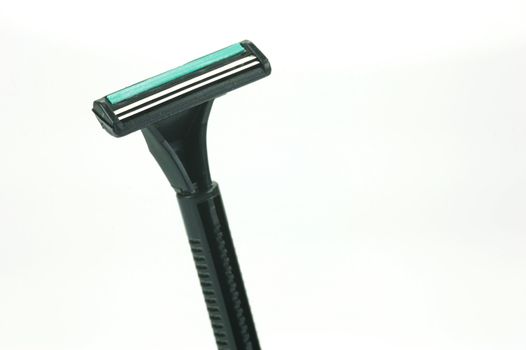 A disposable razor isolated against a white background