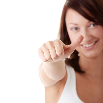 Casual woman smiling with her thumbs making decision - isolated