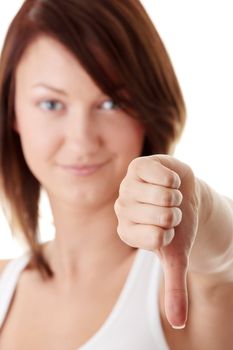 Casual woman smiling with her thumbs down - isolated