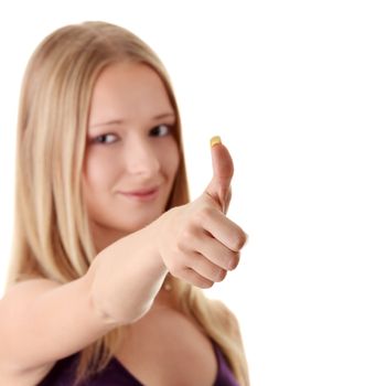 Casual woman smiling with her thumbs up - isolated