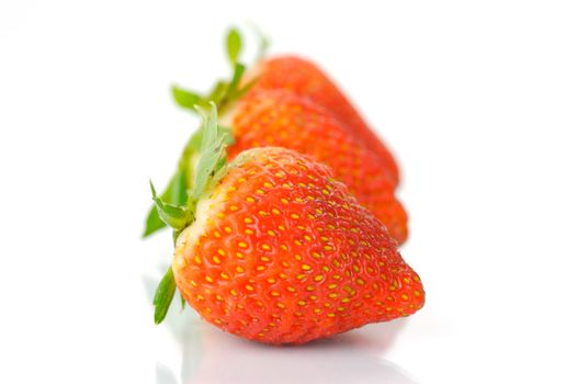 Fresh strawberries isolated against a white background