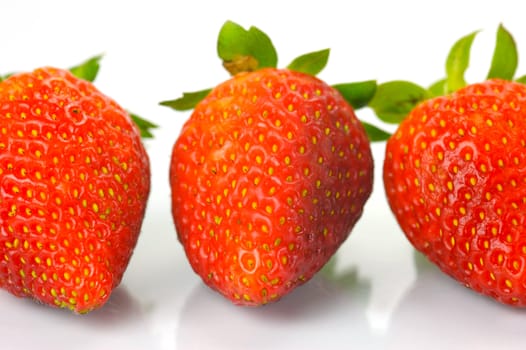 Fresh strawberries isolated against a white background