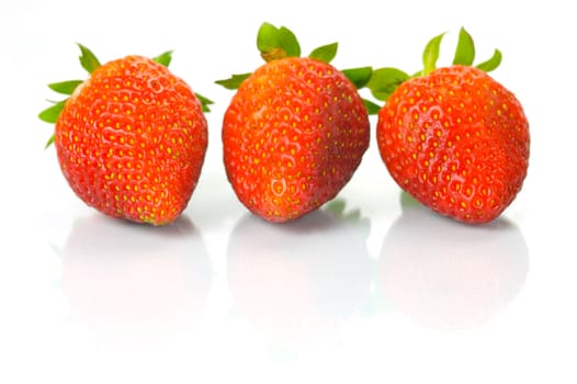 Fresh strawberries isolated against a white background