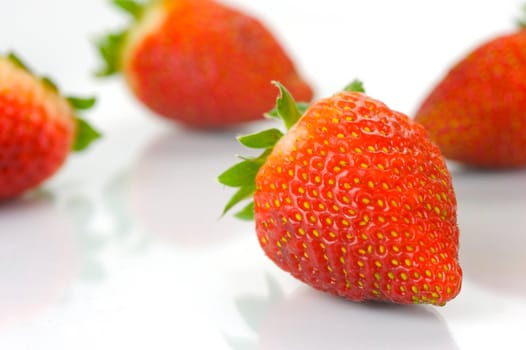 Fresh strawberries isolated against a white background