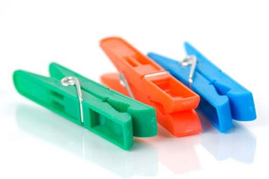 Clothes line pegs isolated against a white background