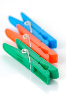 Clothes line pegs isolated against a white background