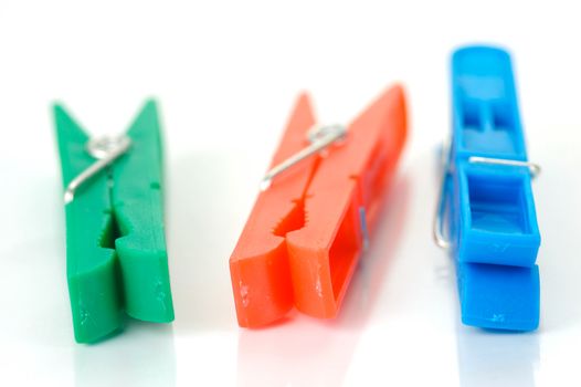 Clothes line pegs isolated against a white background