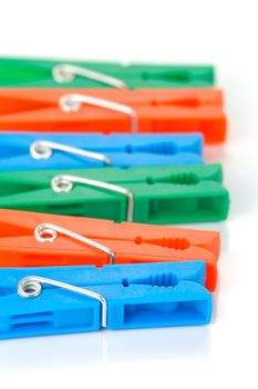 Clothes line pegs isolated against a white background