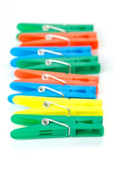 Clothes line pegs isolated against a white background