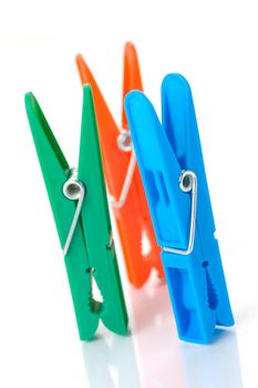 Clothes line pegs isolated against a white background