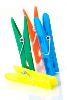 Clothes line pegs isolated against a white background