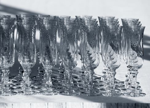 Wine glasses in lines. B/w + blue tone