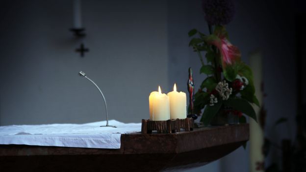 The Altar of a catholic Church with painting