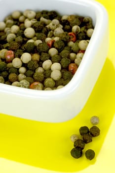 A close up shot of mixed pepper corns mixed together