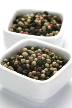A close up shot of mixed pepper corns mixed together