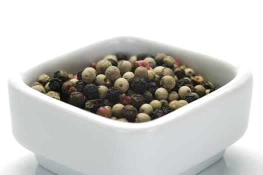 A close up shot of mixed pepper corns mixed together