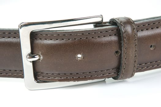 Brown belts isolated against a white background