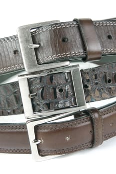 Brown belts isolated against a white background