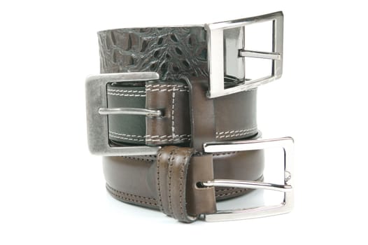 Brown belts isolated against a white background