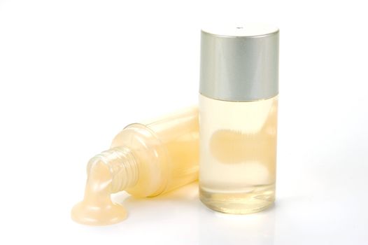 Miniatureshampoo bottles isolated against a white background