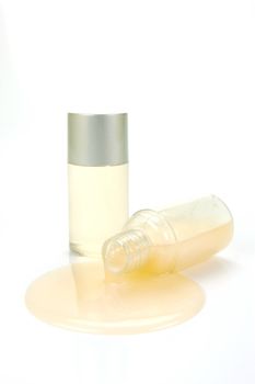 Miniatureshampoo bottles isolated against a white background